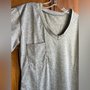 V- neck, pocket tee with shirttail hem